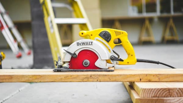 circular saw on a plank of wood
