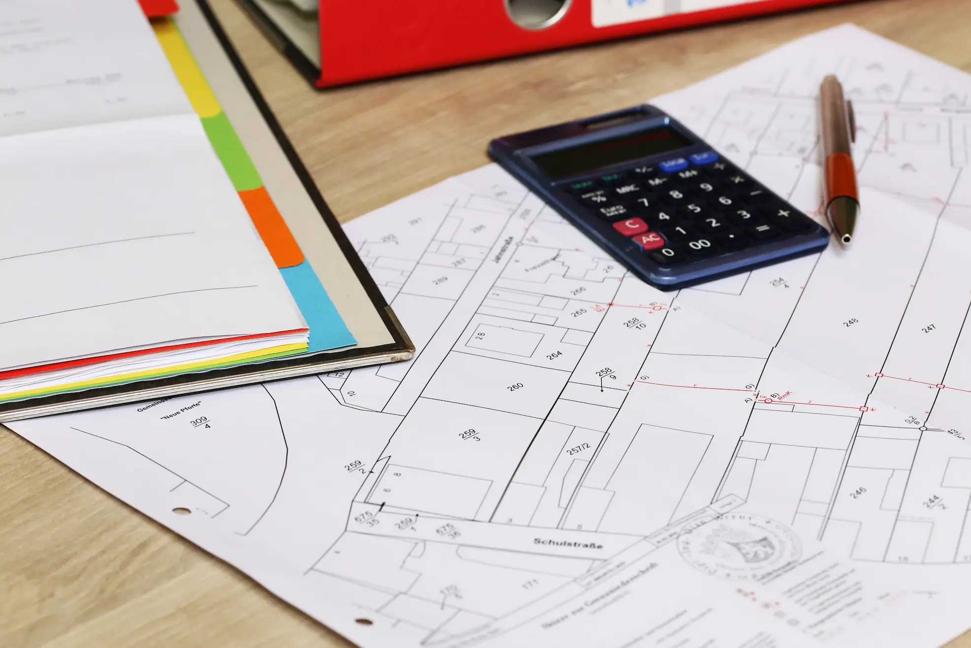 calculator on top of building plans