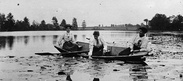 old vacation photo of 3 women in a small boat