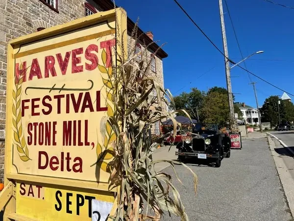 orig_events_delta_harvest_festival_sign_2022_classic_restored_truck_in_front_of_old_stone_mill_full_permissions_marie_white.webp