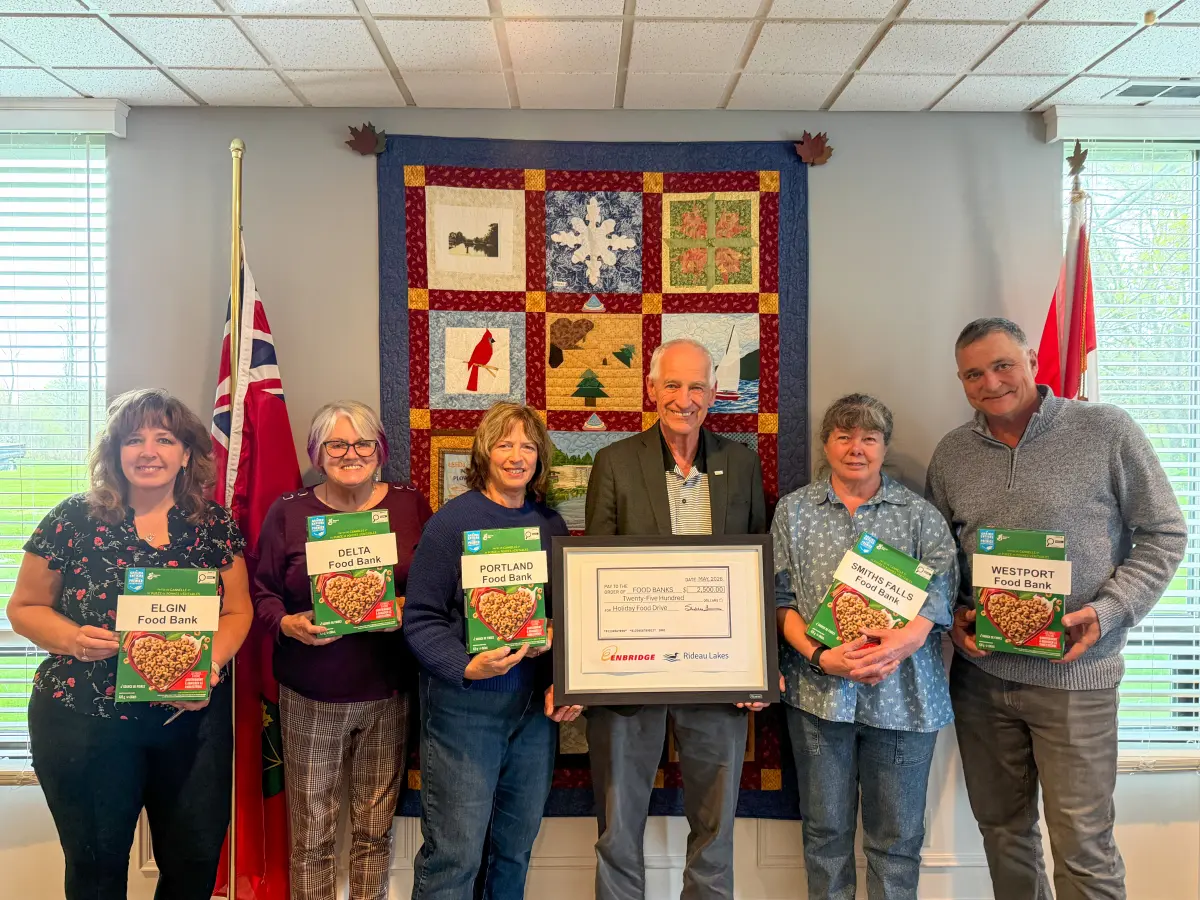 staff holding boxes for food bank
